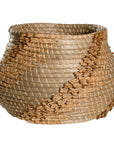 Handwoven seagrass basket with organic textured detailing, featuring natural tones and intricate weaving, ideal for contemporary home decor