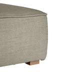 A versatile moss modular ottoman with soft linen upholstery, designed for effortless comfort and modern living. Perfect as a standalone piece or paired with matching modular seating