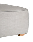 A versatile wheat modular ottoman with soft linen upholstery, designed for effortless comfort and modern living. Perfect as a standalone piece or paired with matching modular seating