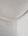 A versatile wheat modular ottoman with soft linen upholstery, designed for effortless comfort and modern living. Perfect as a standalone piece or paired with matching modular seating