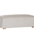 A versatile wheat modular ottoman with soft linen upholstery, designed for effortless comfort and modern living. Perfect as a standalone piece or paired with matching modular seating