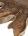 Koro serving board in teak featuring natural edge detail and rich organic wood grain.