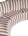 Laguna modular sofa in cinnabar stripe fabric with curved form and soft cushions on a clean background.