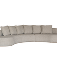 Laguna modular sofa in oat drift fabric with curved form and soft cushions on a clean background.