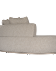 Laguna modular sofa in oat drift fabric with curved form and soft cushions on a clean background.