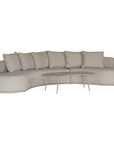 Laguna modular sofa in oat drift fabric with curved form and soft cushions on a clean background.
