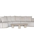 Laguna modular sofa in sand stripe fabric with curved form and soft cushions on a clean background.