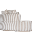 Laguna modular sofa in sand stripe fabric with curved form and soft cushions on a clean background.