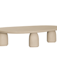 Lantara coffee table in driftstone finish with sculptural pedestal base and soft rounded top.