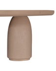 Lantara coffee table large in nomad dune finish with elongated oval top and three rounded sculptural legs.