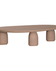 Lantara coffee table large in nomad dune finish with elongated oval top and three rounded sculptural legs.