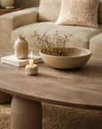 Lantara large coffee table in nomad dune styled in a warm neutral living room with textured rug and soft sofa backdrop.