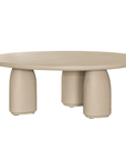 Lantara coffee table in driftstone finish with sculptural pedestal base and soft rounded top.