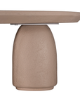 Lantara coffee table small in nomad dune finish with rounded top and three sculptural cylindrical legs.