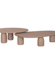 Lantara coffee table small in nomad dune finish with rounded top and three sculptural cylindrical legs.