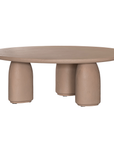 Lantara coffee table small in nomad dune finish with rounded top and three sculptural cylindrical legs.