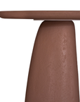 Lantara side table in a cinnabar clay finish with round top and elongated sculptural leg.