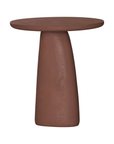 Lantara side table in a cinnabar clay finish with round top and elongated sculptural leg.