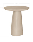 Lantara side table in driftstone finish with sculptural pedestal base and soft rounded top.