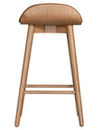A stylish bar stool featuring a smooth tan leather seat and a sturdy natural oak frame. Designed with comfort and durability in mind, this contemporary stool is perfect for modern kitchens and dining spaces.