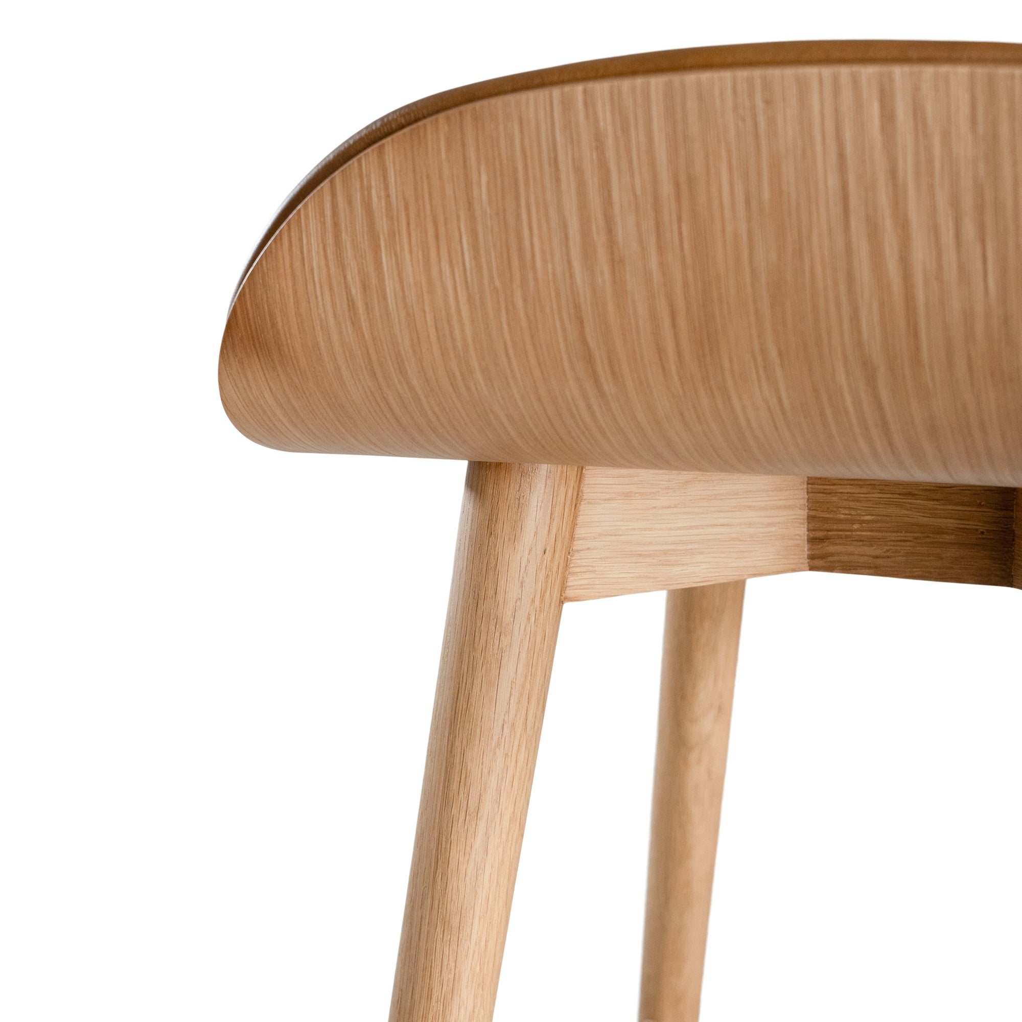 A stylish bar stool featuring a smooth tan leather seat and a sturdy natural oak frame. Designed with comfort and durability in mind, this contemporary stool is perfect for modern kitchens and dining spaces.