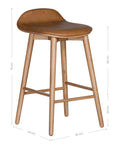 A stylish bar stool featuring a smooth tan leather seat and a sturdy natural oak frame. Designed with comfort and durability in mind, this contemporary stool is perfect for modern kitchens and dining spaces.