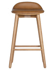A stylish bar stool featuring a smooth tan leather seat and a sturdy natural oak frame. Designed with comfort and durability in mind, this contemporary stool is perfect for modern kitchens and dining spaces.