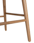 A stylish bar stool featuring a smooth tan leather seat and a sturdy natural oak frame. Designed with comfort and durability in mind, this contemporary stool is perfect for modern kitchens and dining spaces.