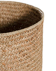 The Kulala Living Handwoven Seagrass Basket Set includes three beautifully crafted storage baskets made from natural seagrass. Featuring a tightly woven design for durability and an organic aesthetic, these baskets provide stylish and functional storage for any home.