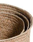 The Kulala Living Handwoven Seagrass Basket Set includes three beautifully crafted storage baskets made from natural seagrass. Featuring a tightly woven design for durability and an organic aesthetic, these baskets provide stylish and functional storage for any home.