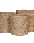 The Kulala Living Handwoven Seagrass Basket Set includes three beautifully crafted storage baskets made from natural seagrass. Featuring a tightly woven design for durability and an organic aesthetic, these baskets provide stylish and functional storage for any home.
