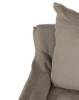 Natural linen one seater sofa with plush cushions, featuring a relaxed and stylish design for effortless comfort