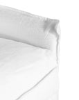 White linen three seater sofa with plush cushions, featuring a relaxed and stylish design for effortless comfort