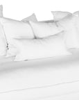 White linen three seater sofa with plush cushions, featuring a relaxed and stylish design for effortless comfort