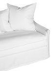 White linen three seater sofa with plush cushions, featuring a relaxed and stylish design for effortless comfort