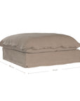 A plush linen slipcover ottoman in a warm taupe tone, featuring a relaxed silhouette with a soft cushion top. Perfect for versatile seating, a footrest, or as a stylish accent in contemporary and coastal-inspired interiors