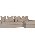 Linen slipcover sectional sofa, designed for effortless comfort and relaxed elegance. Features a modular design with plush cushions and a timeless neutral hue