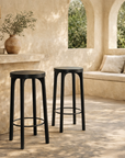 Lola back barchair in black timber styled at a rendered mediterranean verandah bar with arched windows and built in bench seating