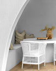 Lumara cheese plate in solid natural wood with round profile, visible timber grain and low pedestal feet.