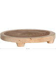 Lumara cheese plate in solid natural wood with round profile, visible timber grain and low pedestal feet.