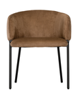 Lumo dining chair in hazelnut with soft upholstered seat and curved backrest on slim black legs shown in a clean minimal setting.