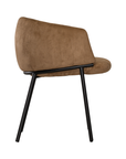 Lumo dining chair in hazelnut with soft upholstered seat and curved backrest on slim black legs shown in a clean minimal setting.