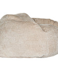 The Kulala Living luxe boucle bean bag in a soft natural hue, offering plush comfort with a stylish textured fabric. Designed for relaxation, this oversized bean bag creates a cosy, modern seating option for any living space