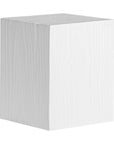 Kulala Living solid magnesium oxide block side table, showcasing organic grain patterns and a minimalist cube design. A versatile and stylish furniture piece