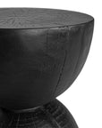 A sculptural solid magnesium oxide side table featuring an elegant hourglass silhouette with a natural wood grain finish. Perfect as a bedside table or accent piece in contemporary and coastal-inspired interiors