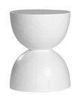 A sculptural solid magnesium oxide side table featuring an elegant hourglass silhouette with a natural wood grain finish. Perfect as a bedside table or accent piece in contemporary and coastal-inspired interiors