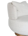 The Maja Occasional Chair from Kulala Living, a luxurious boucle swivel chair with a plush, rounded silhouette and a natural timber base, designed for both style and comfort in contemporary interiors
