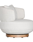 The Maja Occasional Chair from Kulala Living, a luxurious boucle swivel chair with a plush, rounded silhouette and a natural timber base, designed for both style and comfort in contemporary interiors