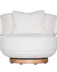 The Maja Occasional Chair from Kulala Living, a luxurious boucle swivel chair with a plush, rounded silhouette and a natural timber base, designed for both style and comfort in contemporary interiors