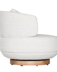 The Maja Occasional Chair from Kulala Living, a luxurious boucle swivel chair with a plush, rounded silhouette and a natural timber base, designed for both style and comfort in contemporary interiors
